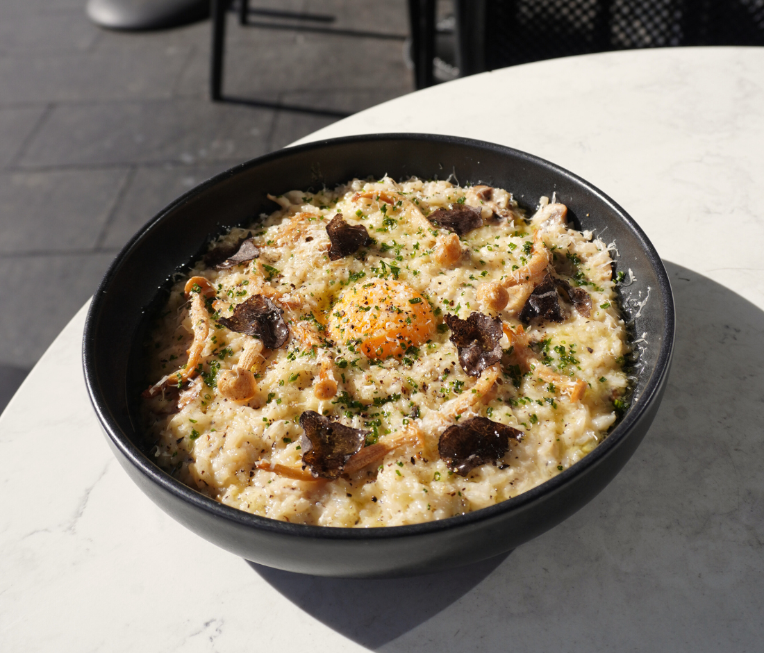 Truffle mushroom risotto topped with egg yolk